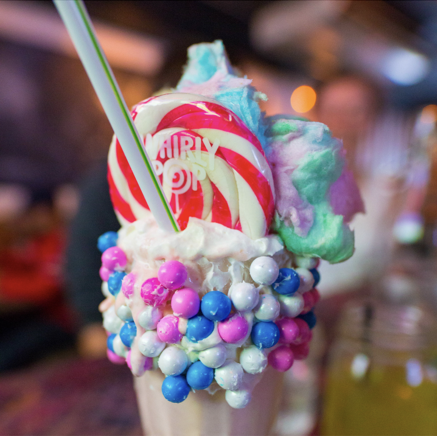 Colorful milkshake with cotton candy - a reminder that small, simple pleasures create lasting memories
